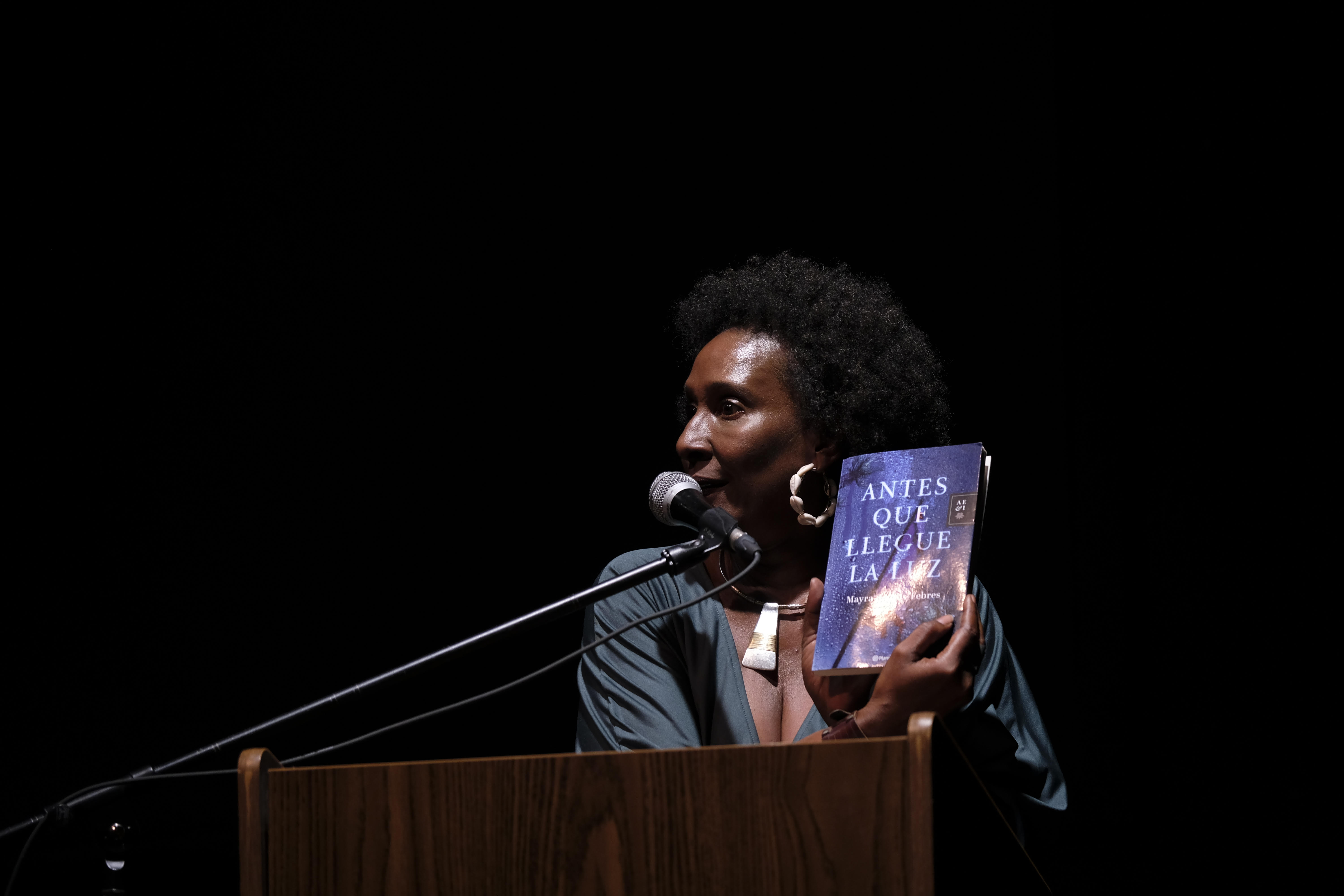 Mayra Santos Febres holding one of her books
