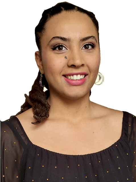 smiling young woman in a black top with gold bead accents